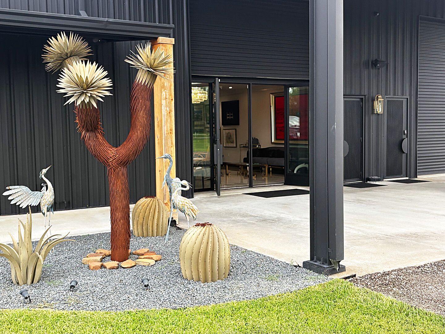 The courtyard entrance off County Road 125. If your appointment is in the Precious Metals Evaluation Room, park in the parking lot, follow the signs, and walk to the far left door, the main door of the Black House. If your appointment is in the VIP showroom, pull straight up in front of the showroom doors and stop on the concrete pad under the awning. We come out and greet you.